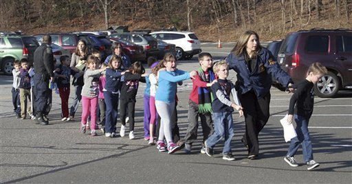 Children being evacuated from what should have been a safe space at Sandy Hook Elementary School in Newtown CT.